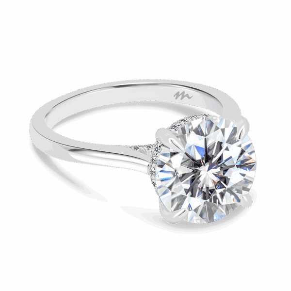 Hattie Round 10 0 Angled White Gold Moissanite 4 Prong Accented Under Rail Bridge Tapered Engagement Ring