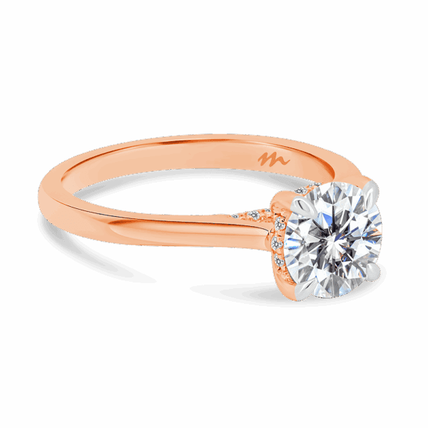 Hattie Round 7 0 Angled Rose Gold Moissanite 4 Prong Accented Under Rail Bridge Tapered Engagement Ring