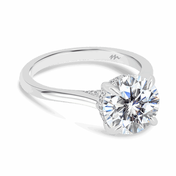 Hattie Round 9 0 Angled White Gold Moissanite 4 Prong Accented Under Rail Bridge Tapered Engagement Ring