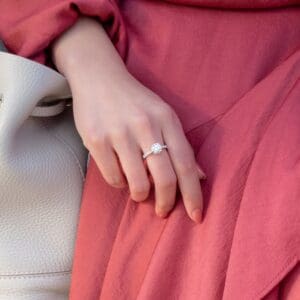 Model Wears Balmain Round 8 0 White Gold Diamond Encrusted Basket Graduating Band Prong Set Engagement Ring