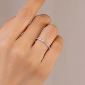 Model Wears Edith 1 3 White Gold Moissanite Prong Set Straight Band V Dip Centre Wedding Ring Blog Post