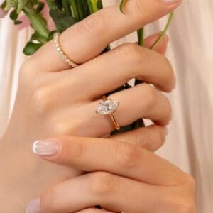 Model Wears Monet Marquise 2 01Ct Yellow Gold Diamond Petal Basket Engagement Ring Blog Post