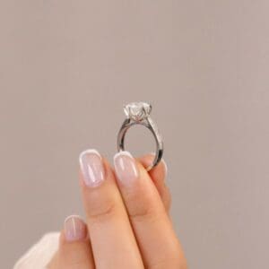 Model Wears Passion 9 0 White Gold Moissanite Tapered Pave Cathedral Setting Floral Gallery Engagement Ring Blog Post