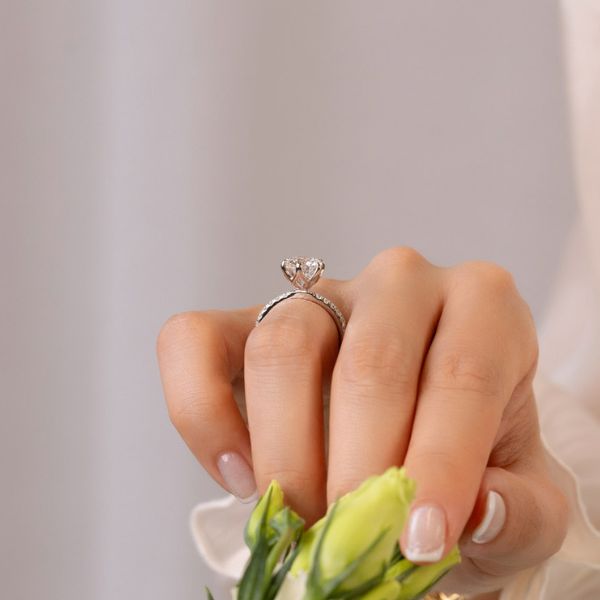 Model Wears Petunia Round 2 01Ct White Gold Lab Grown Diamond Prong Set Interlocking Petal Basket Engagement Ring Blog Post