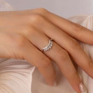 Model Wears Soraya White Gold Moissanite Graduated Round Tiara Jigsaw Band Double Row Wedding Ring Blog Post